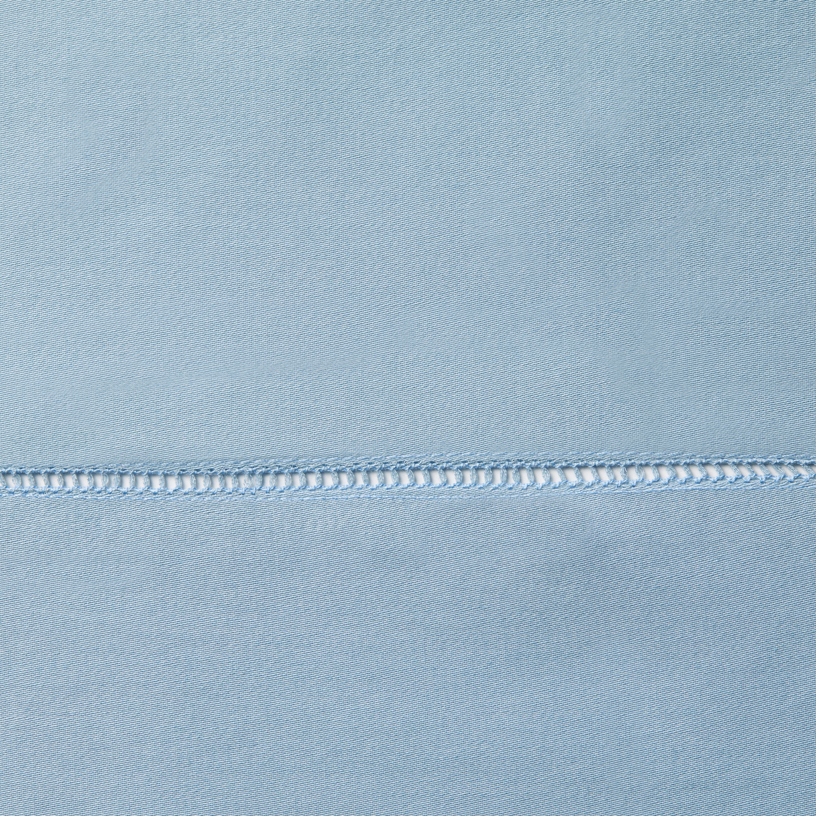 Full Lifestyle Image of Sferra Fiona Bedding with Swatch of Sea