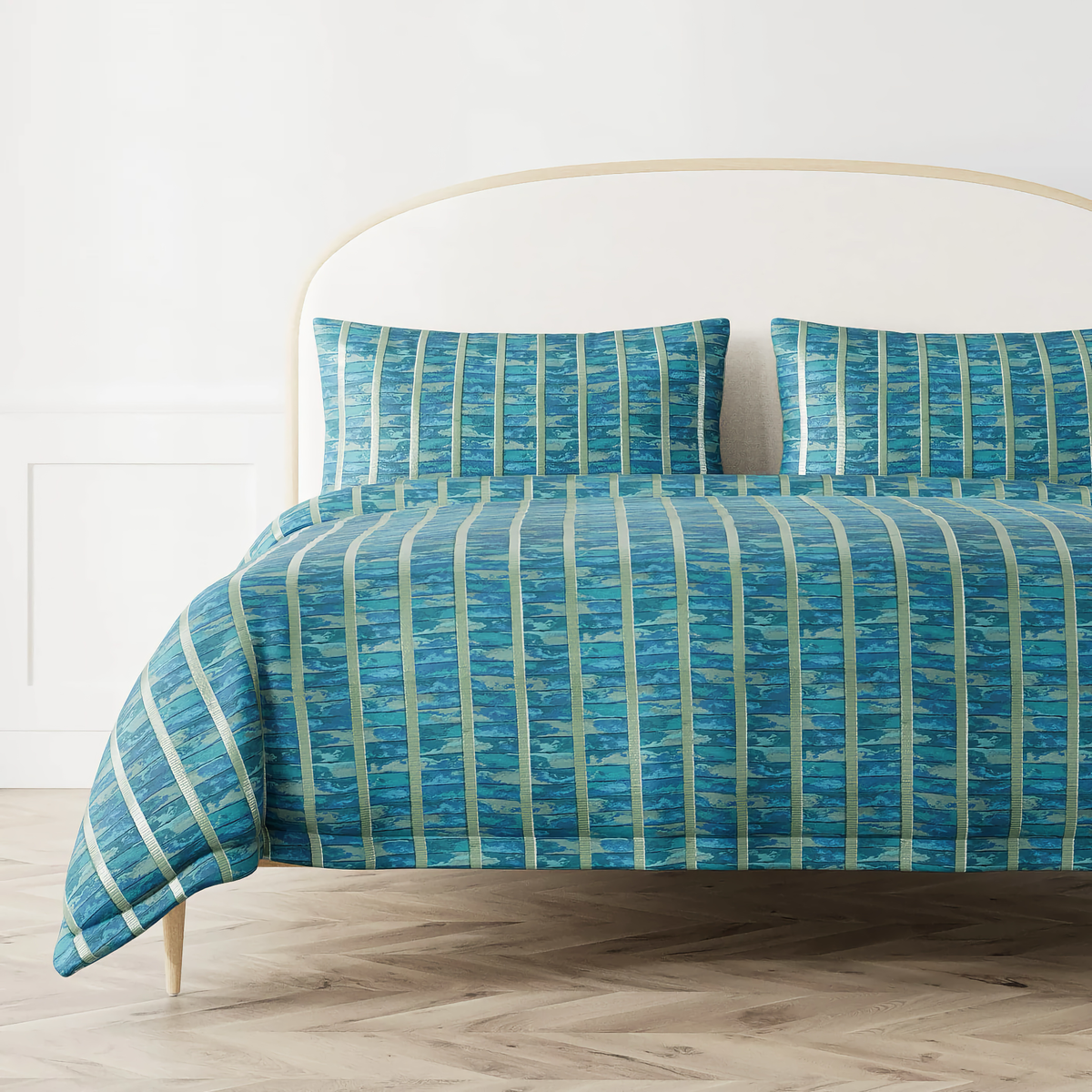Bed with The Met x Ann Gish Egyptian Faience Duvet Cover and Sham in Nile