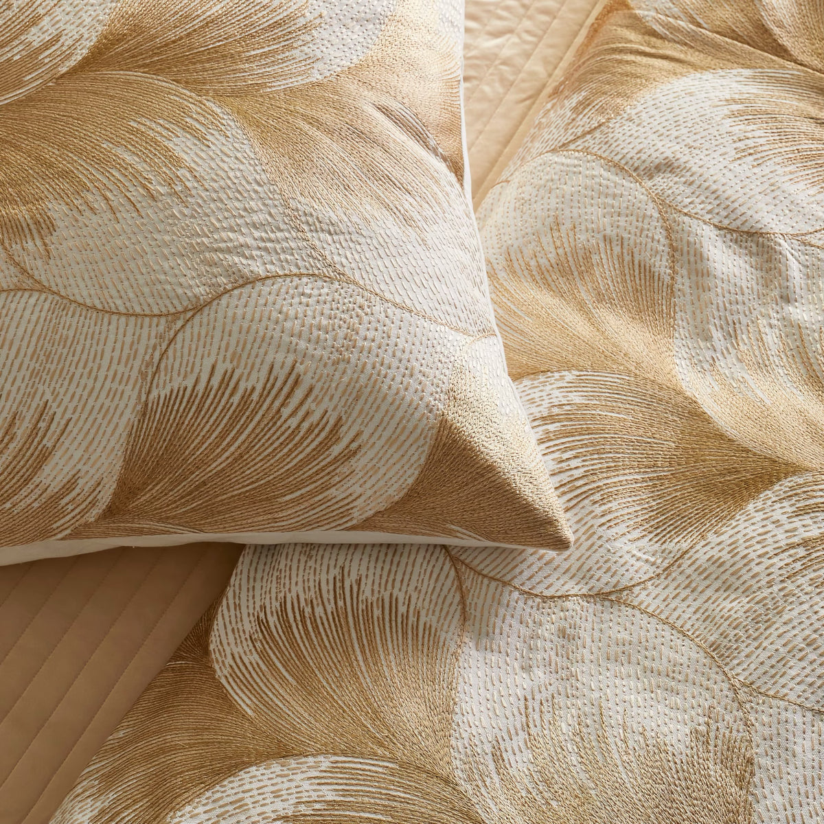 Detail View of The Met x Ann Gish Fan Duvet Cover and Decorative Pillow in White and Gold
