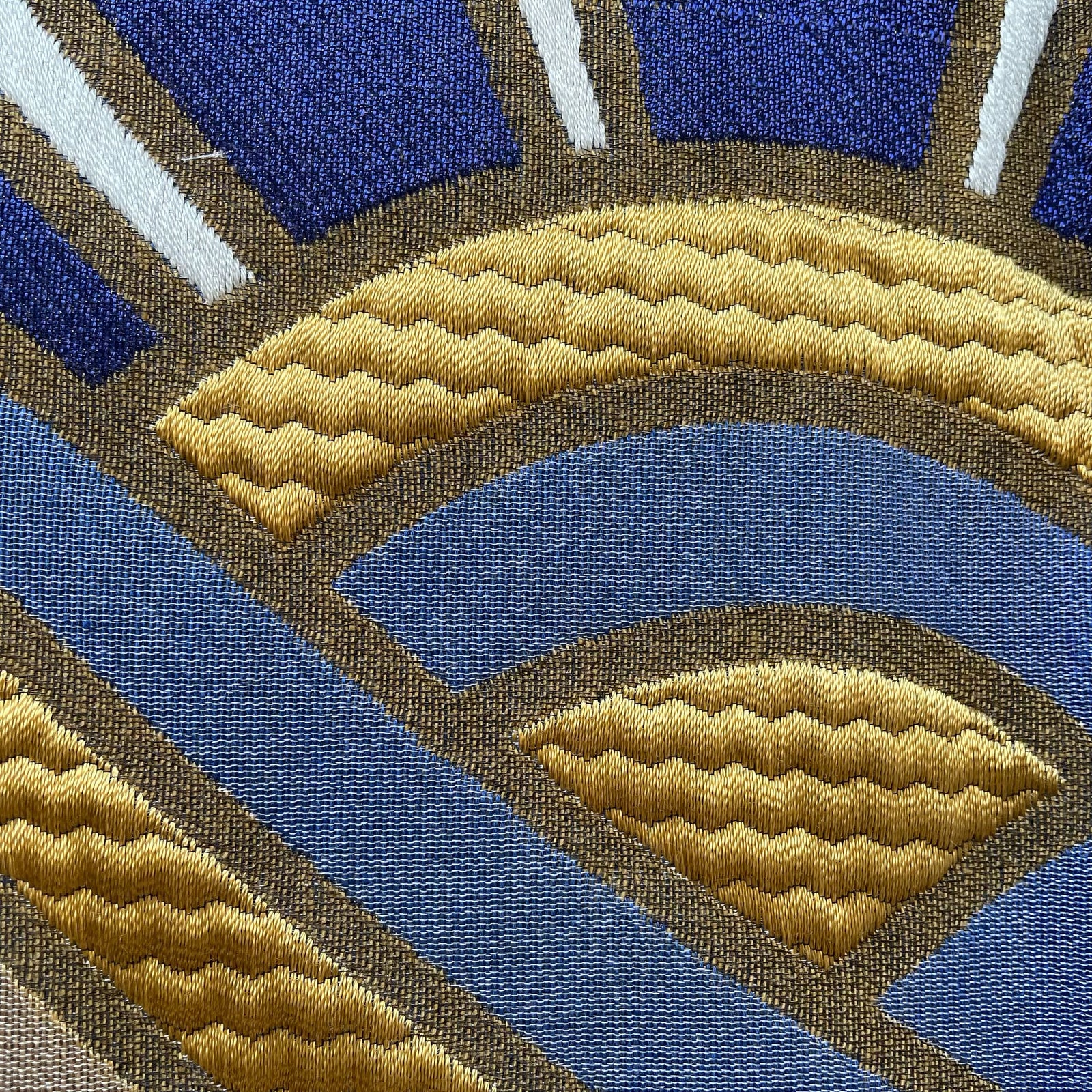 Front View of The Met x Ann Gish Lever du Soleil Throw and Decorative Pillows