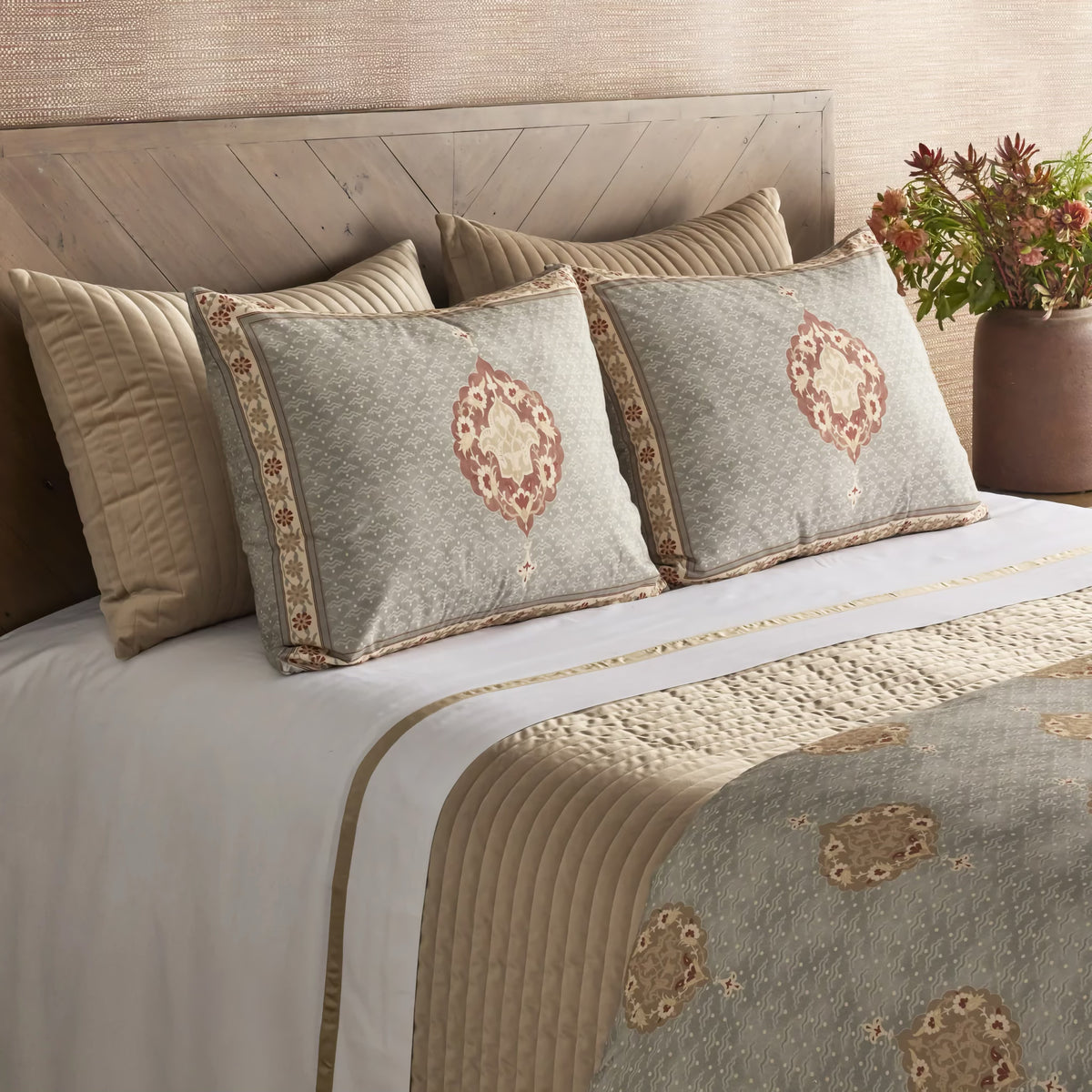 Side view of The Met x Ann Gish Medallion Comforter Set with beige coordinate bedding