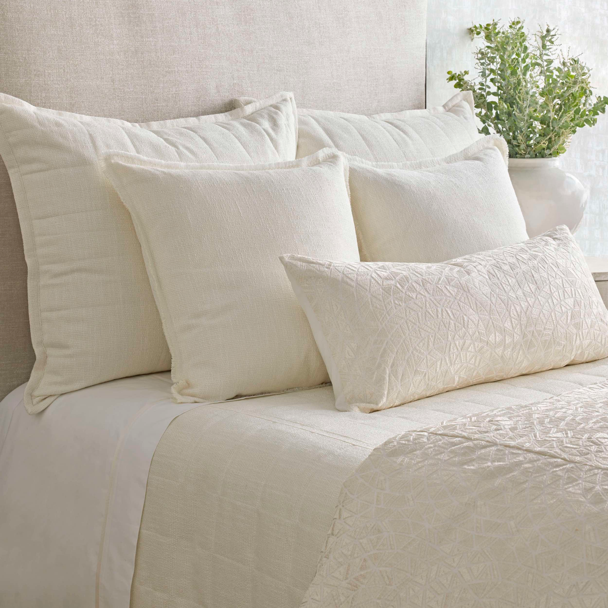 Closeup of The Met x Ann Gish Ornament Duvet Cover and Decorative Pillow in Bone and Bone