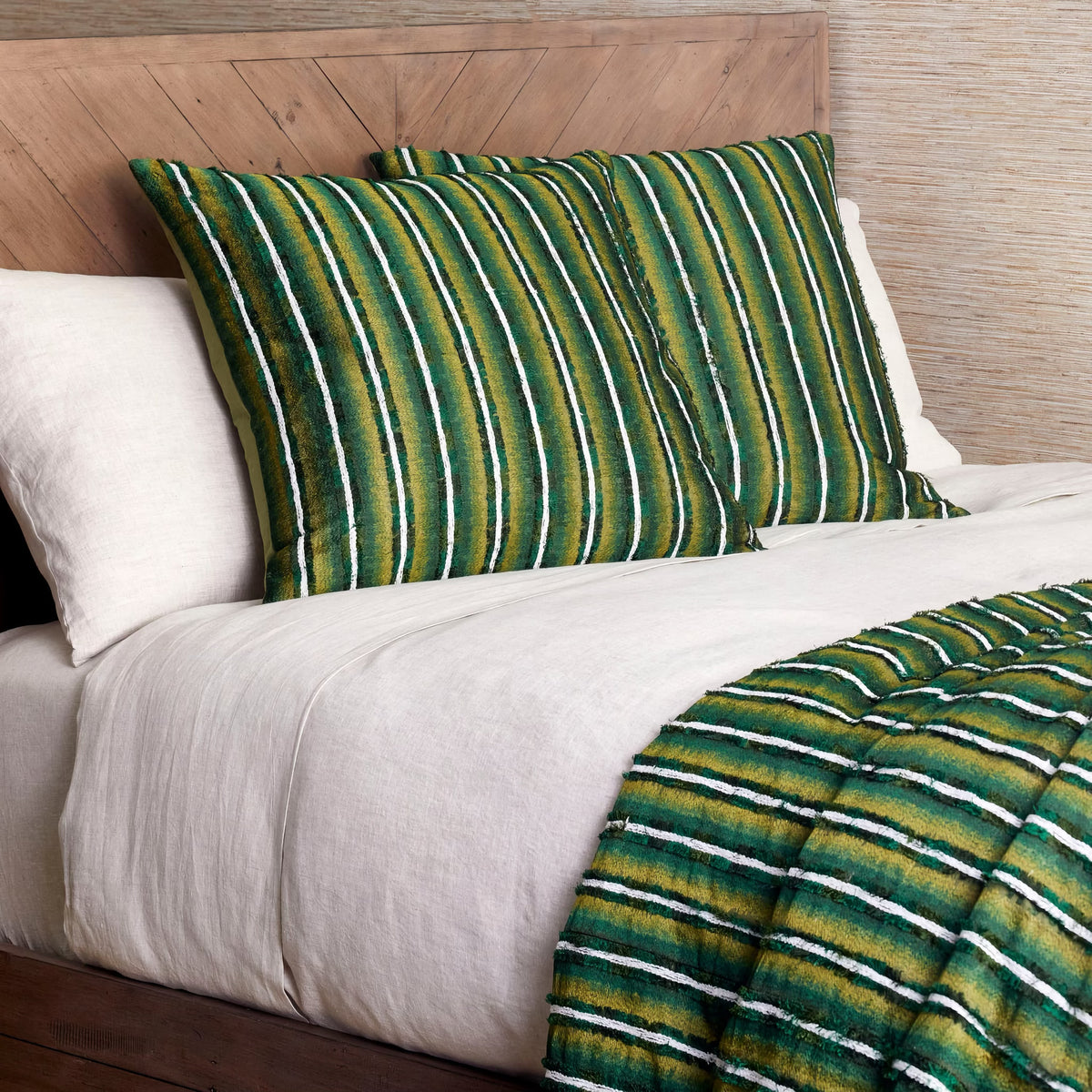 Closeup of The Met x Ann Gish Pluma Duvet Cover and Decorative Pillow in Green