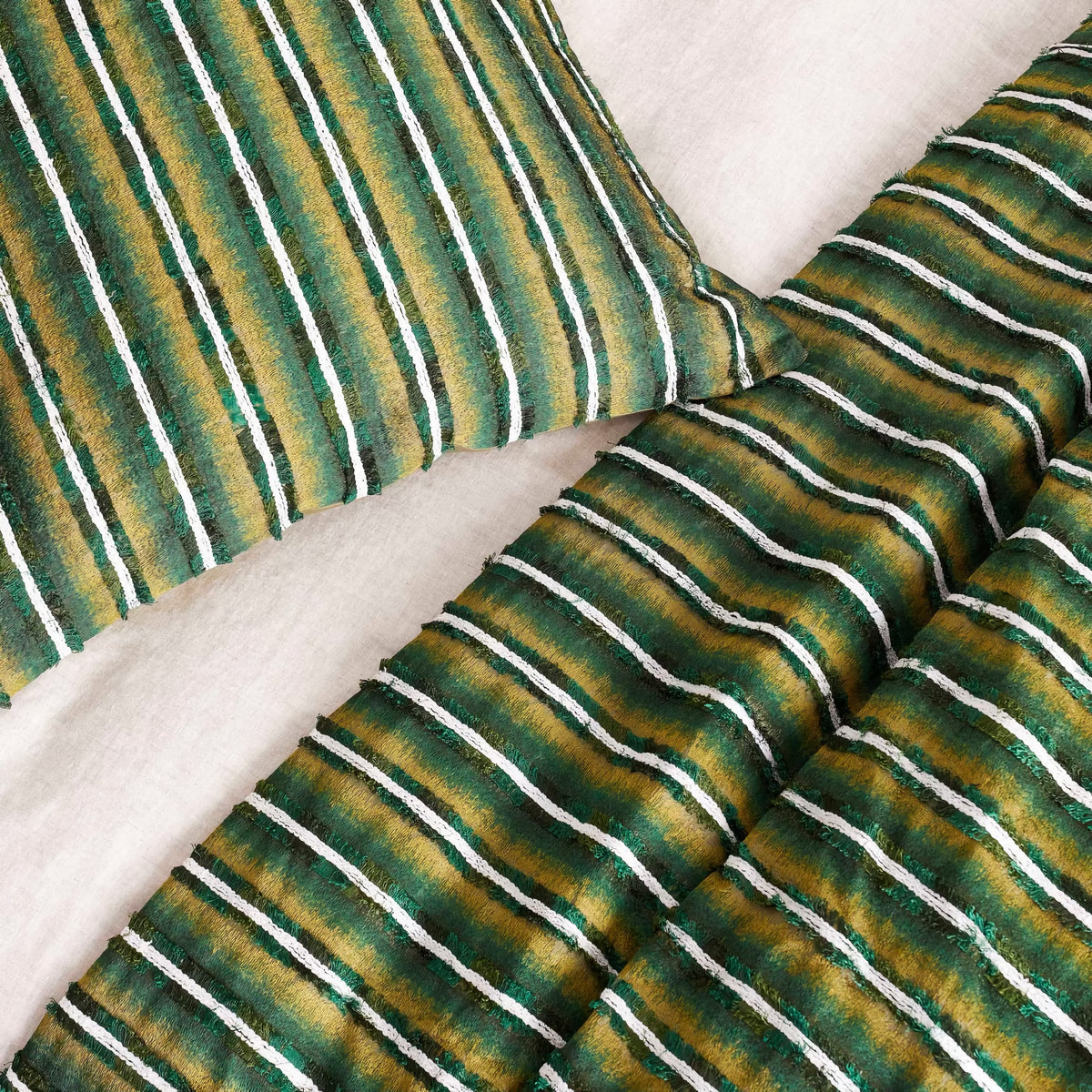 Detail View of The Met x Ann Gish Pluma Duvet Cover and Decorative Pillow in Green