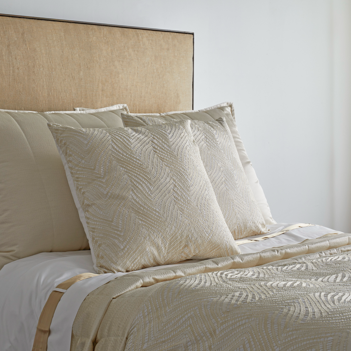 Closeup of The Met x Ann Gish Retortoli Throw and Decorative Pillow in Champagne