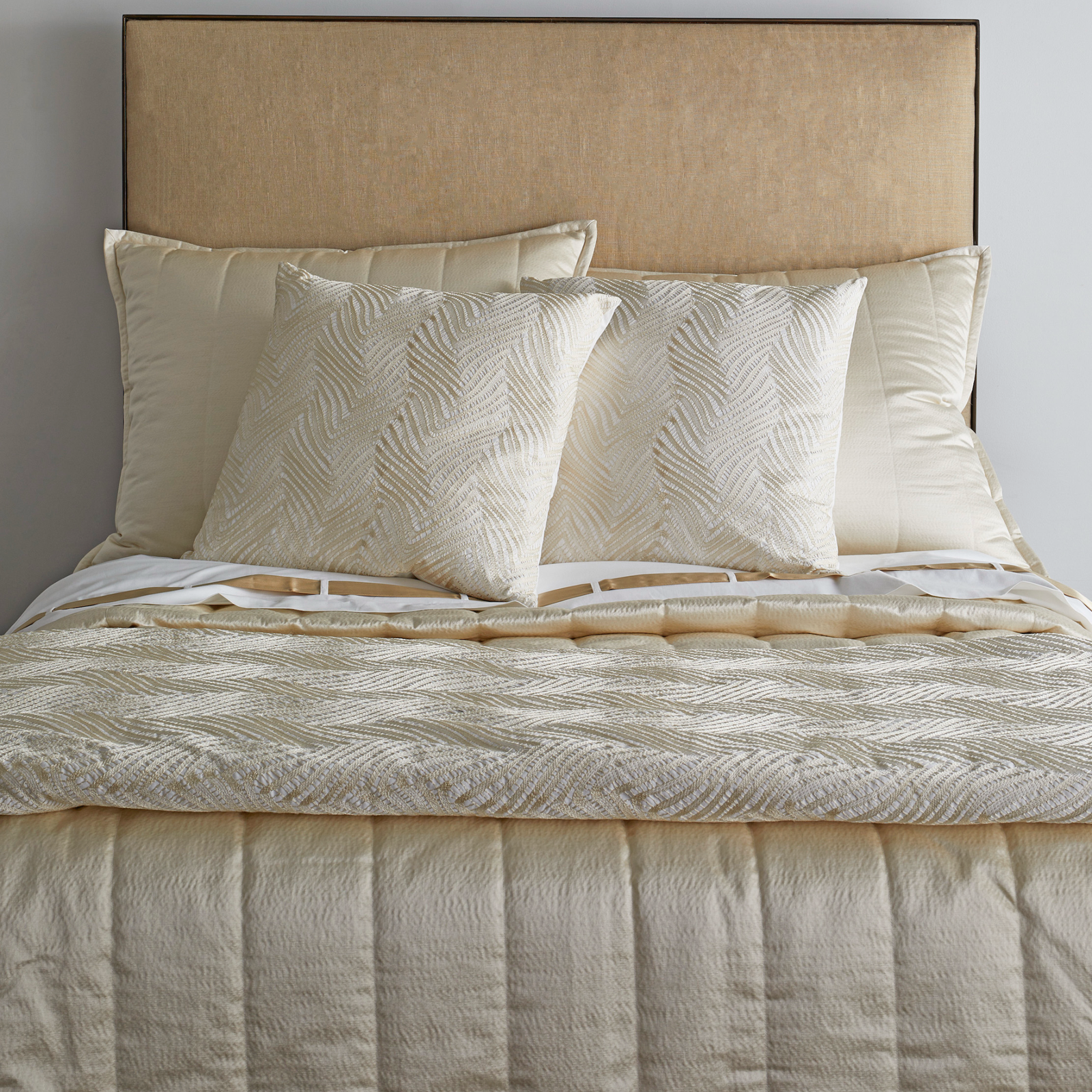 Bed with The Met x Ann Gish Retortoli Throw and Decorative Pillow in Champagne