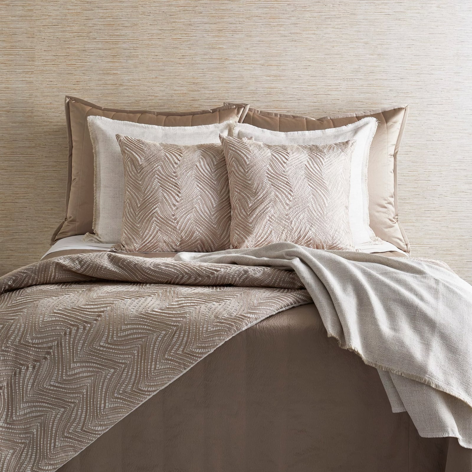 Bed with The Met x Ann Gish Retortoli Throw and Decorative Pillow in Taupe