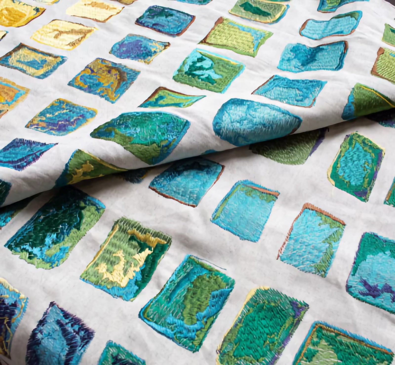 Side View of The Met x Ann Gish Tesserae Mosaic Throw and Decorative Pillow