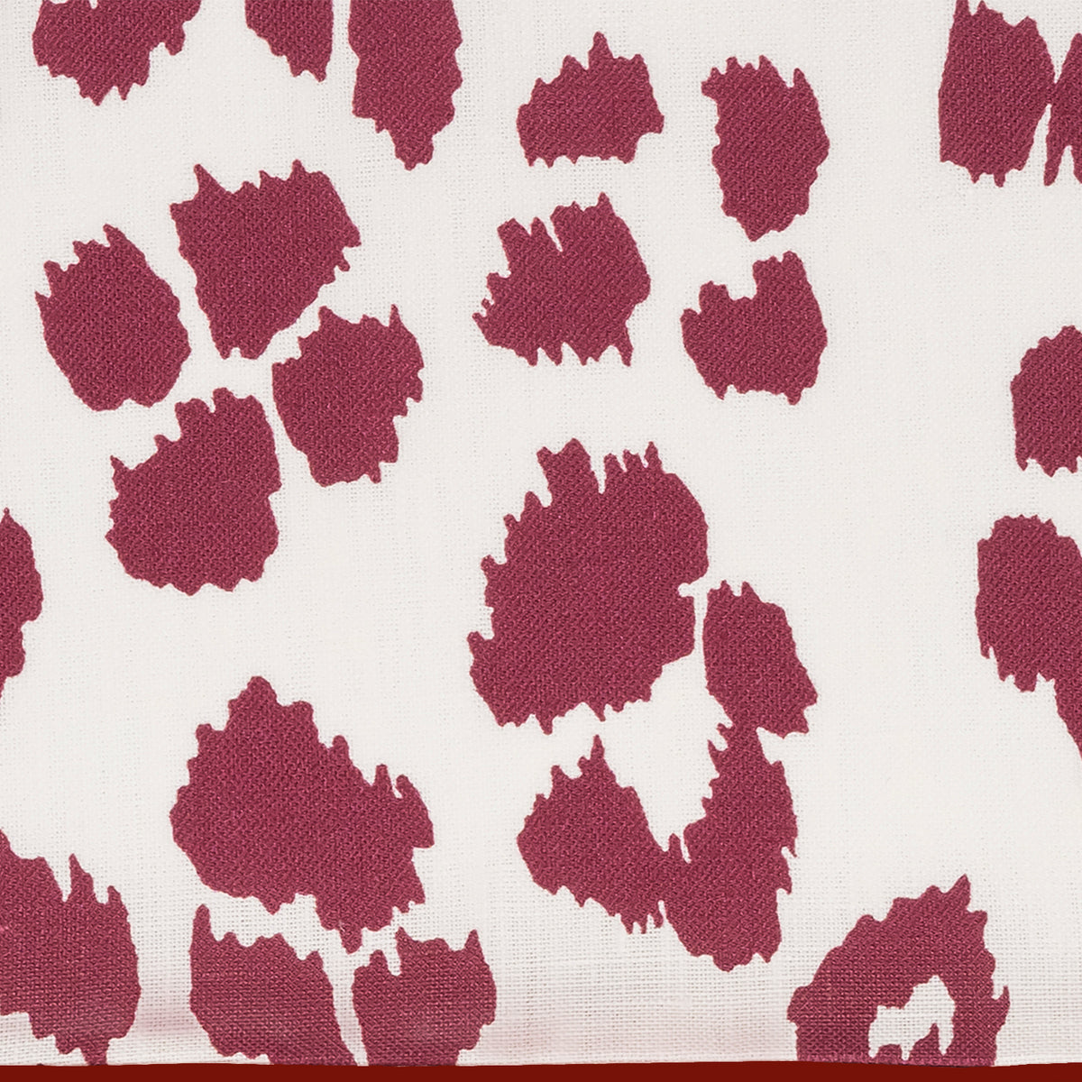 Patterned fabric with purple abstract shapes on a white background