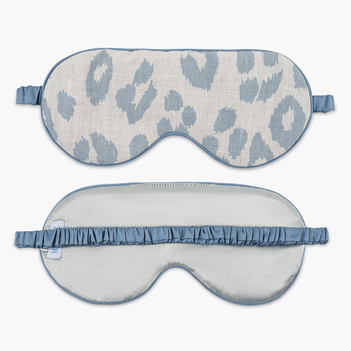 front and reverse of iconic leopard sleep mask in sky