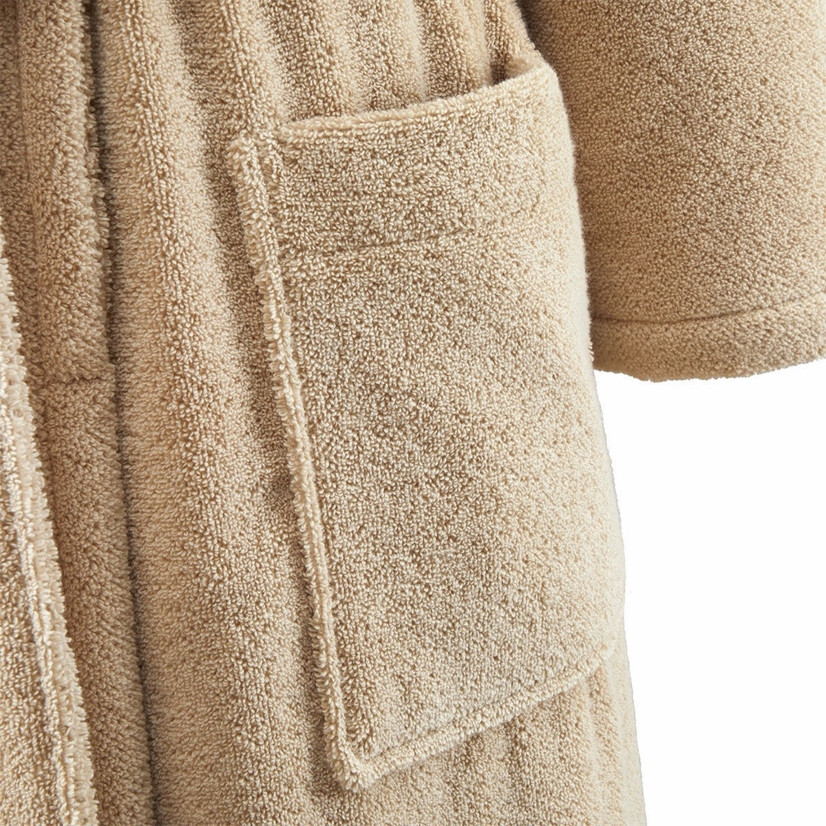 Close-up of Yves Delorme Apollon Bath Robe in Dune color, with a large front pocket and sleeve