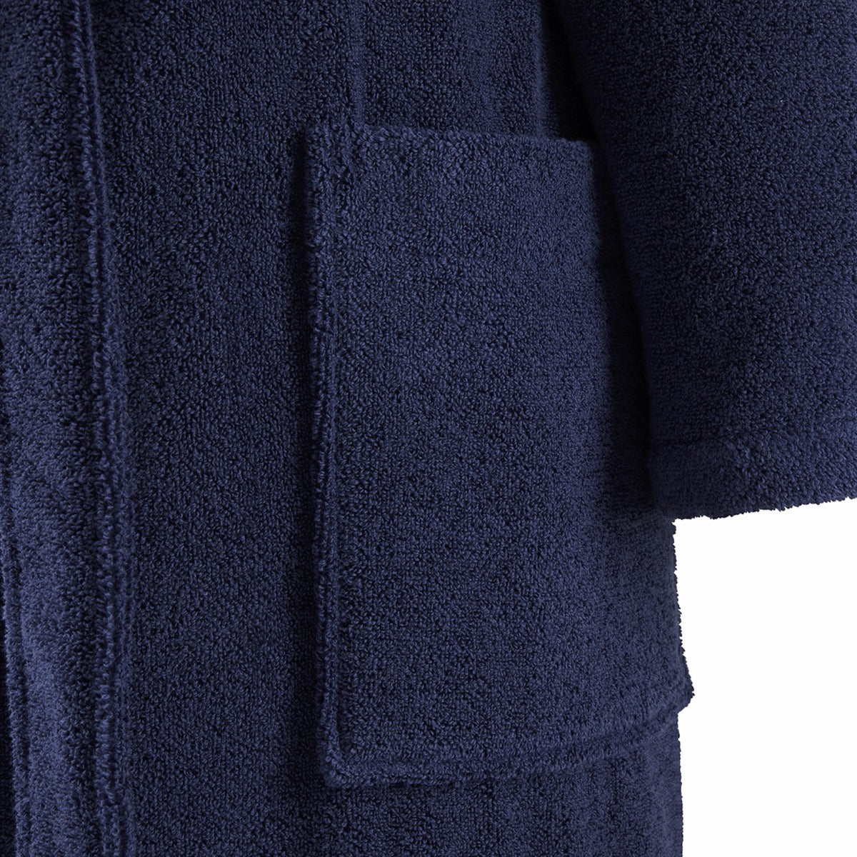 Close-up of Yves Delorme Apollon Bath Robe in Marine color, with a large front pocket and sleeve