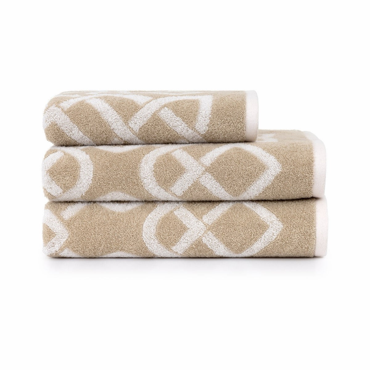 Three folded Yves Delorme Apollon Bath Collection in Dune color stacked neatly against a white background