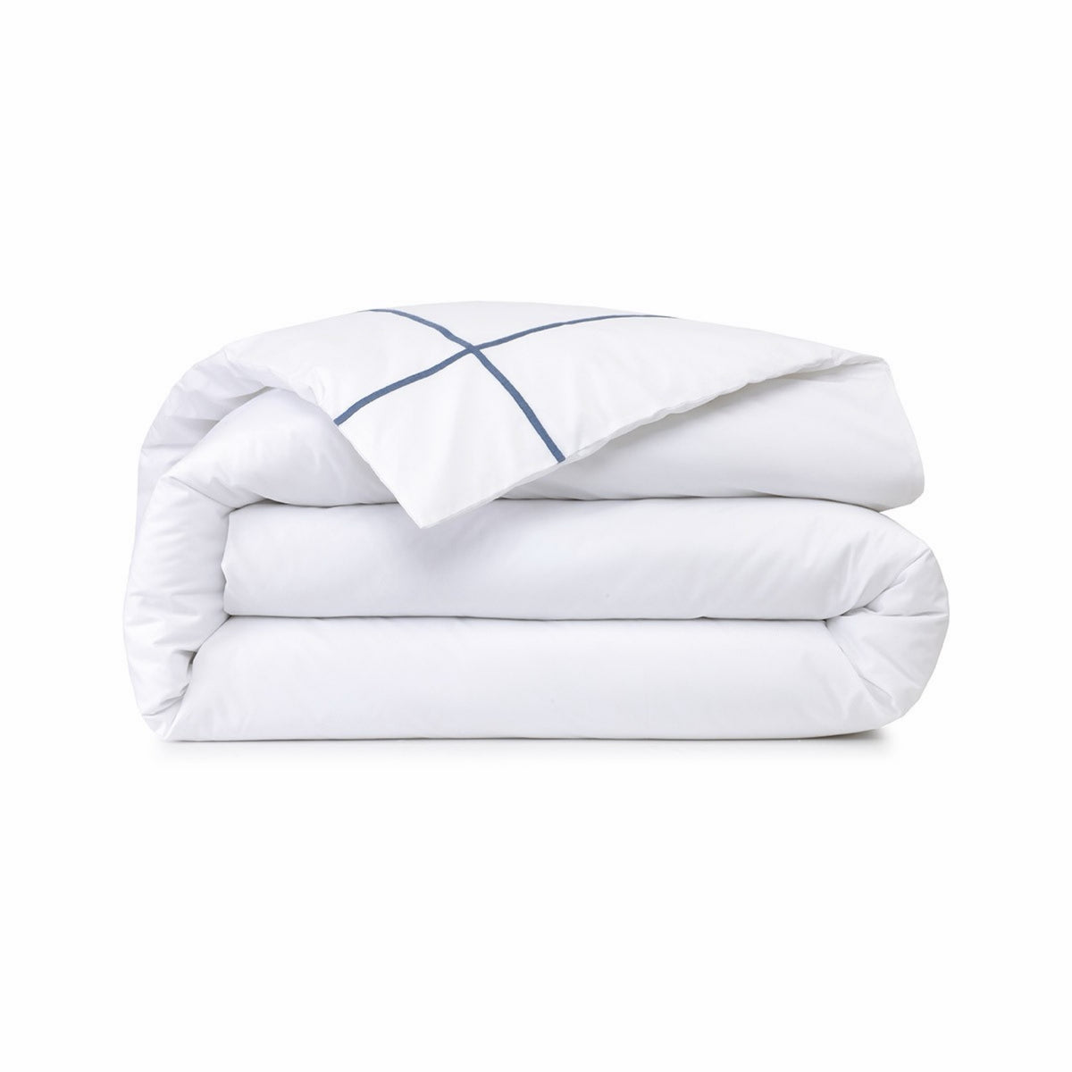 A neatly folded Duvet Cover of Yves Delorme Athena Bedding with Outremer embroidery accent