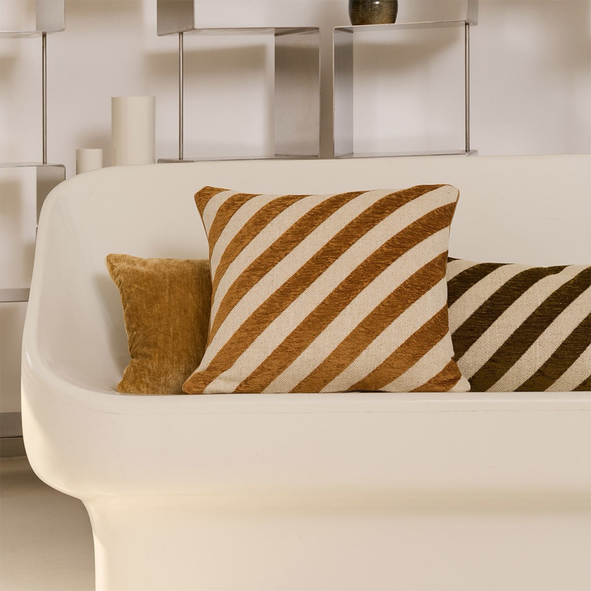 Yves Delorme Calisson Decorative Pillows in Muscade on a couch color