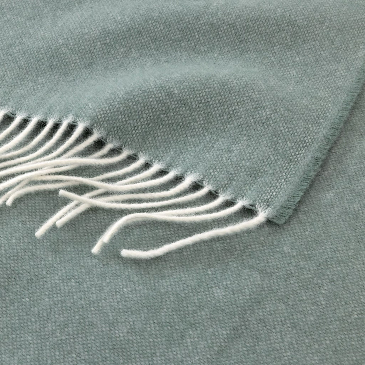 Closeup of Yves Delorme Club Throw in Verones Color