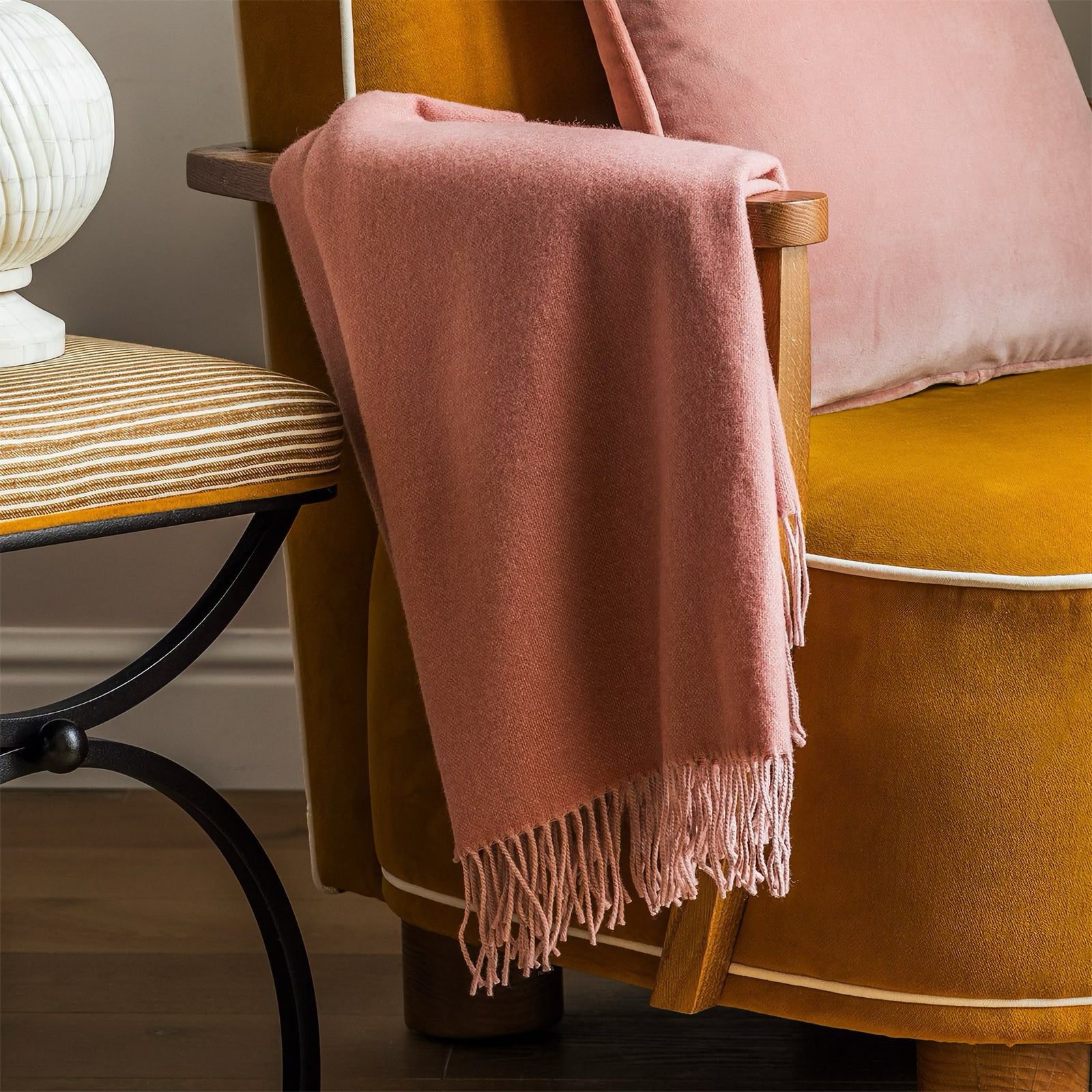 Closeup of Yves Delorme Club Throw in Santal Color on a chair