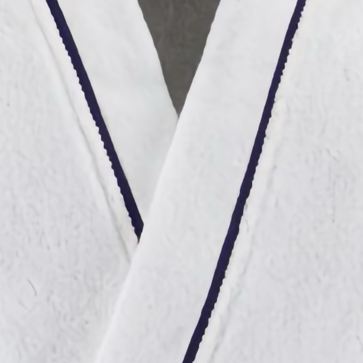 Closeup of Yves Delorme Croisiere Bath Robe in Blanc and Marine colors