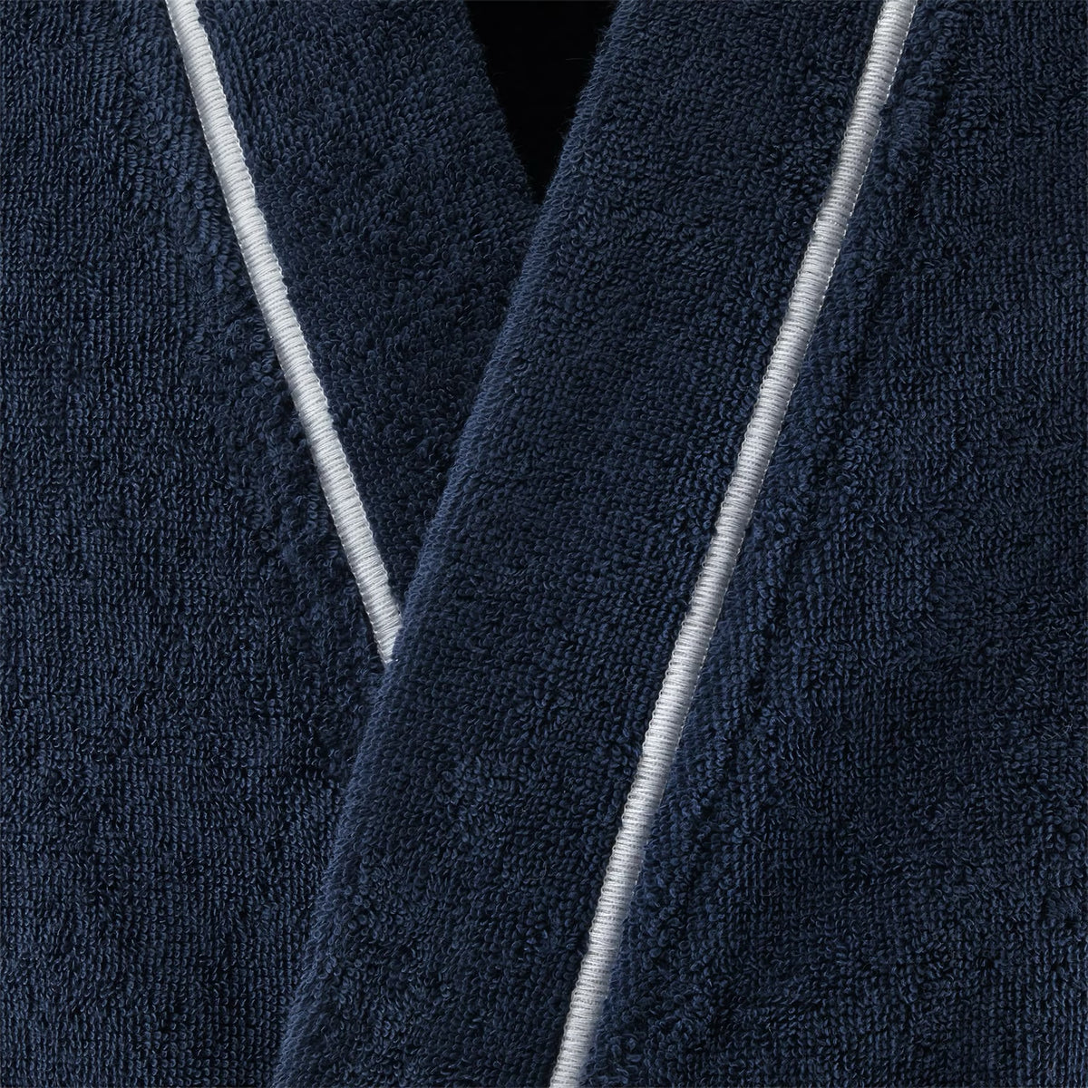 Closeup of Yves Delorme Croisiere Bath Robe in Marine and Blanc colors