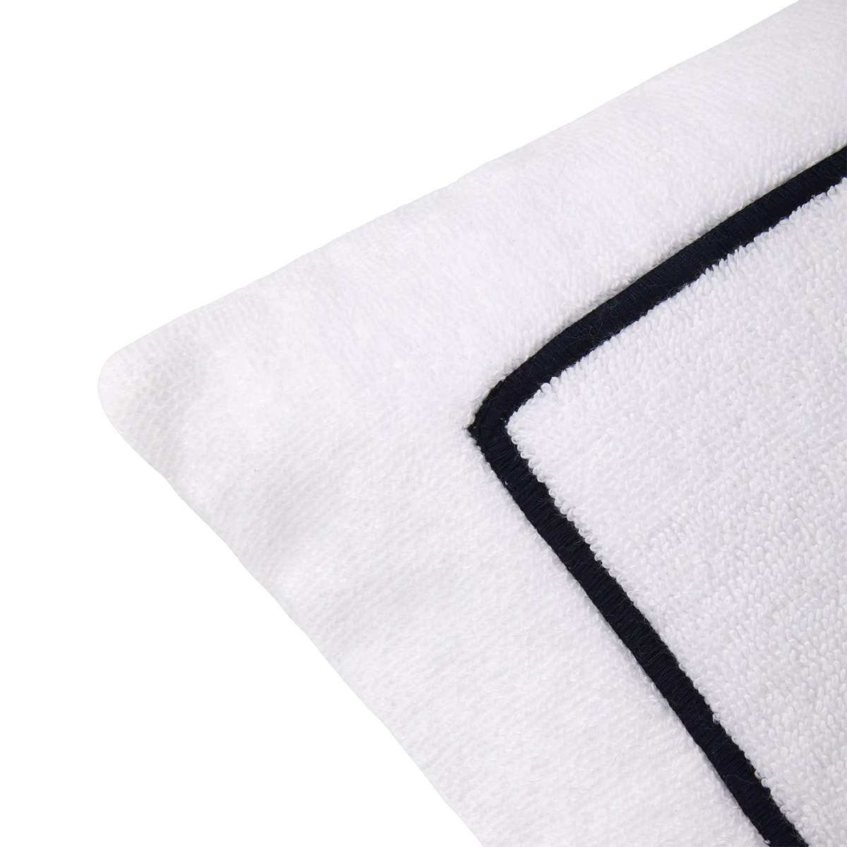 Corner of Yves Delorme Croisiere Beach Pillow in Blanc