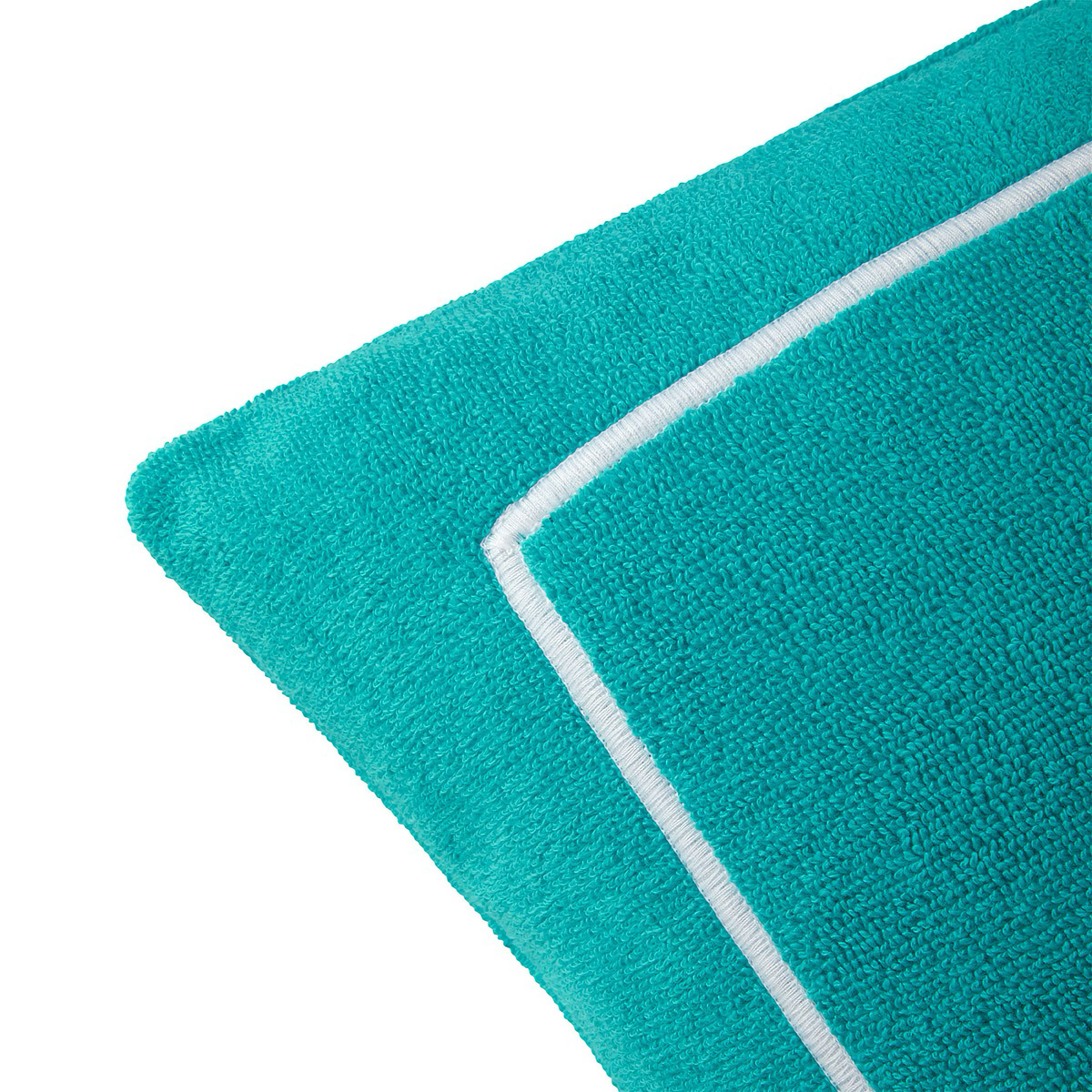 Corner of Yves Delorme Croisiere Beach Pillow in Caraibe 