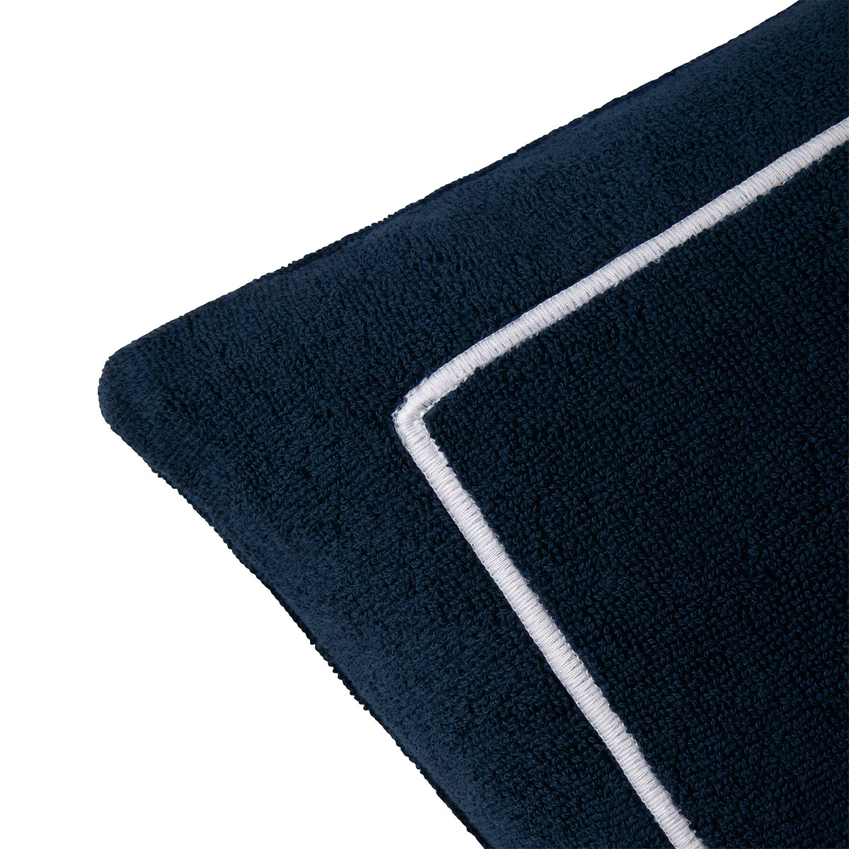 Corner of Yves Delorme Croisiere Beach Pillow in Marine