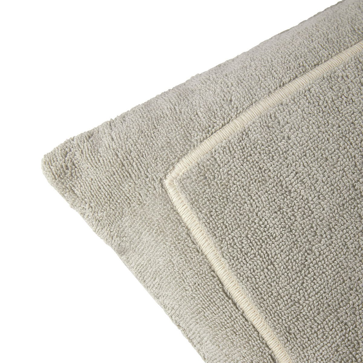 Corner of Yves Delorme Croisiere Beach Pillow in Pierre