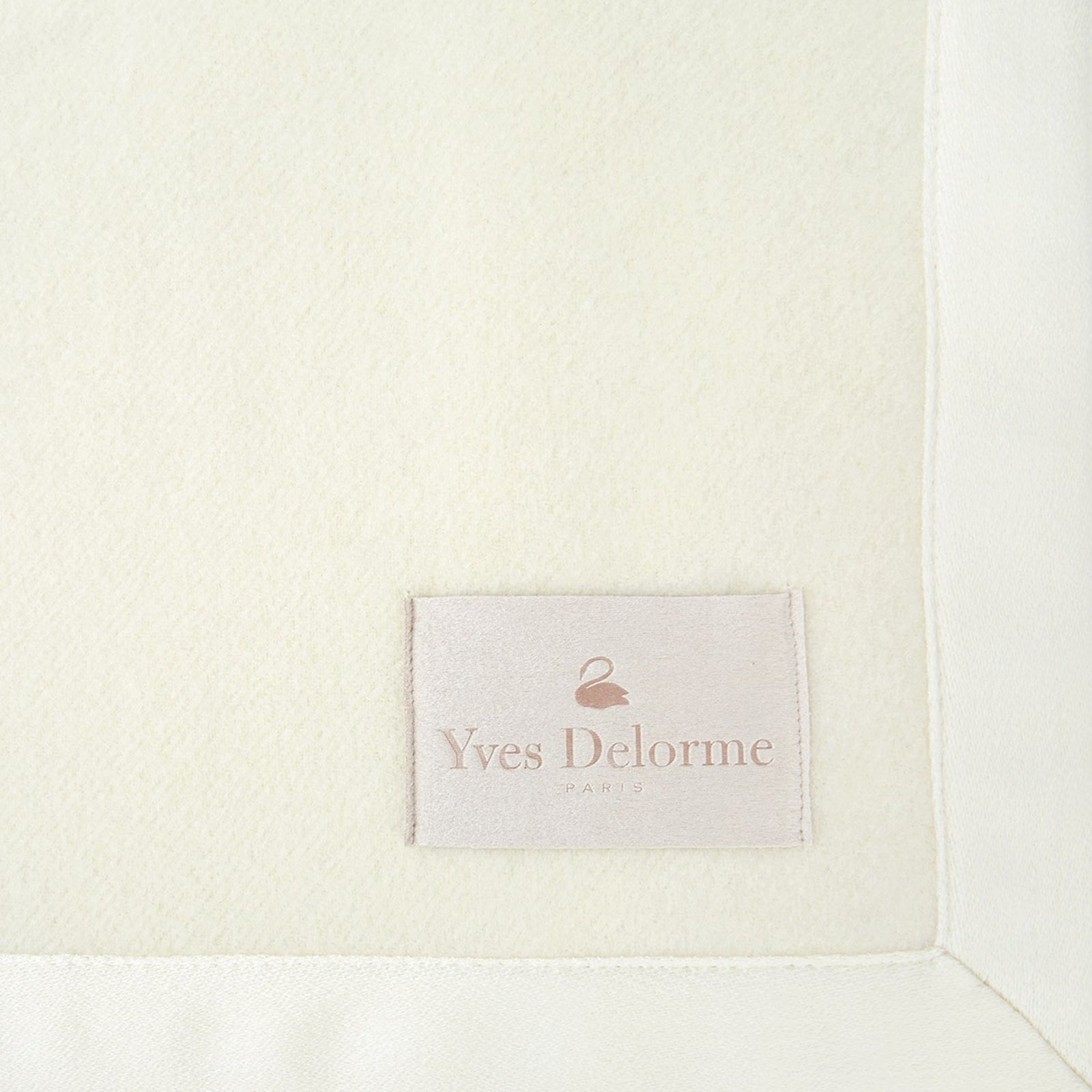 Folded Silo Image of Yves Delorme Duchesse Blanket in Nacre Color