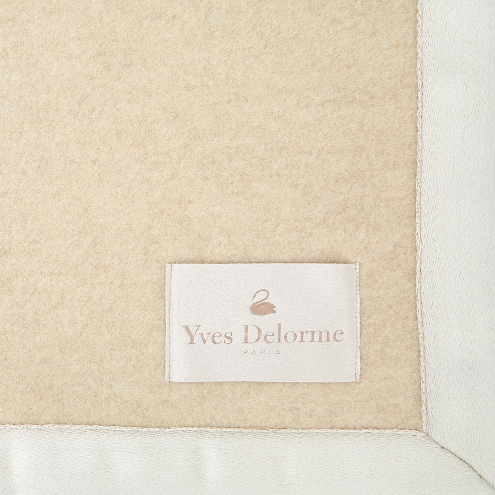 Folded Silo of Yves Delorme Duchesse Blanket in Pierre Color