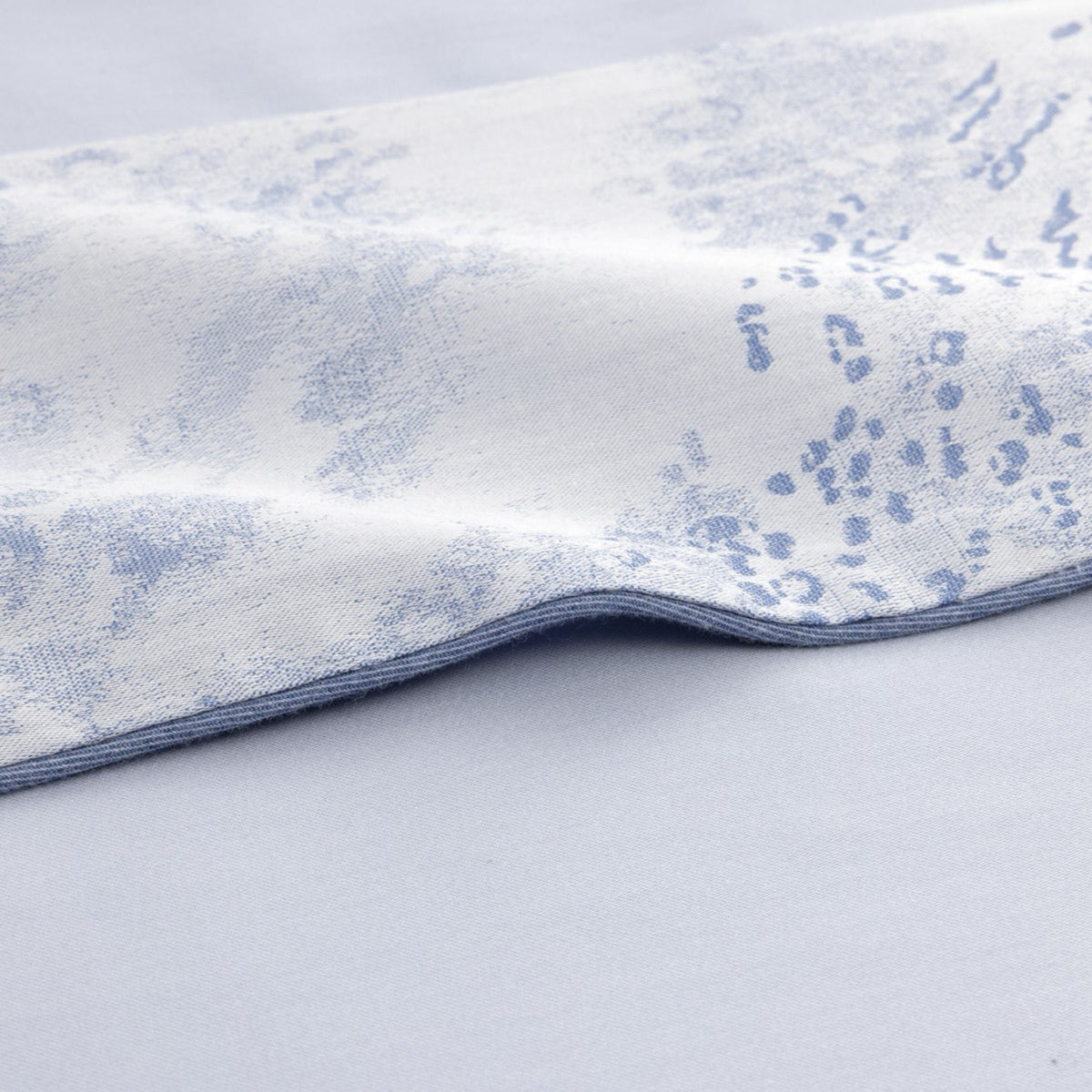 A close-up of Yves Delorme Ecumes Bedding fabric