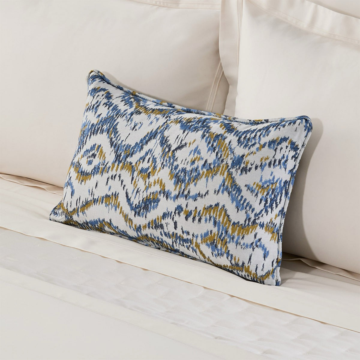 A rectangular decorative pillow of Yves Delorme Ecumes Bedding
