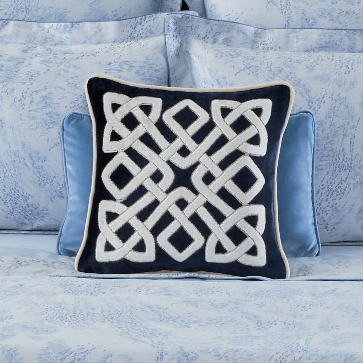 18x18 Yves Delorme Entrelac Decorative Pillow in Marine color with blue bedding