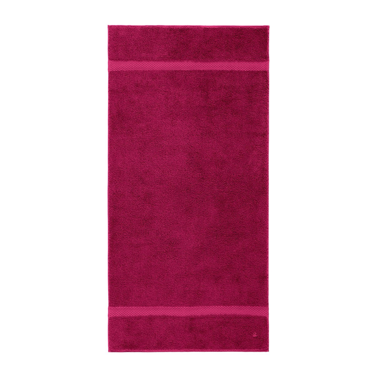 A rectangular, solid magenta Etoile Bath Towel with two textured bands, lying flat on a white background.