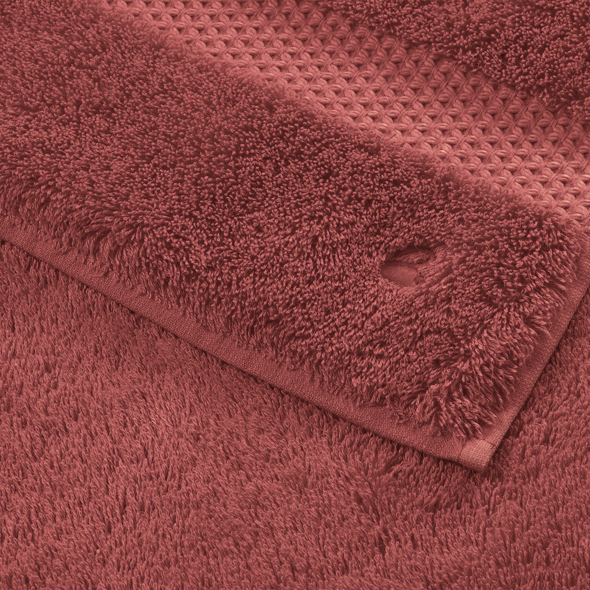 Fabric Closeup of Folded Yves Delorme Etoile Bath Towels and Mat in Santal
