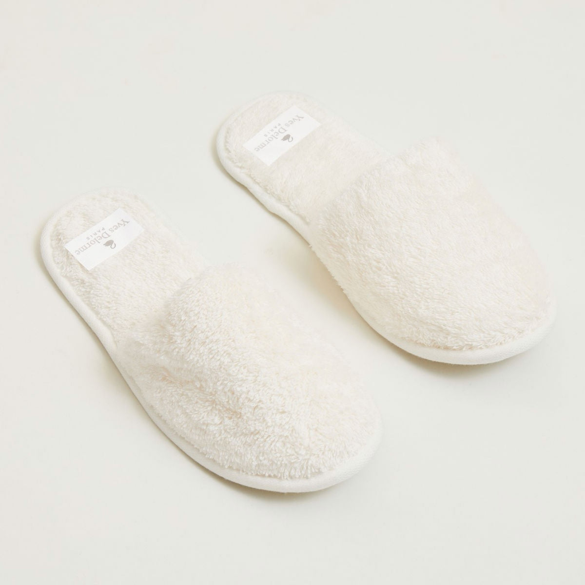Angled view of Nacre Yves Delorme Etoile Slippers