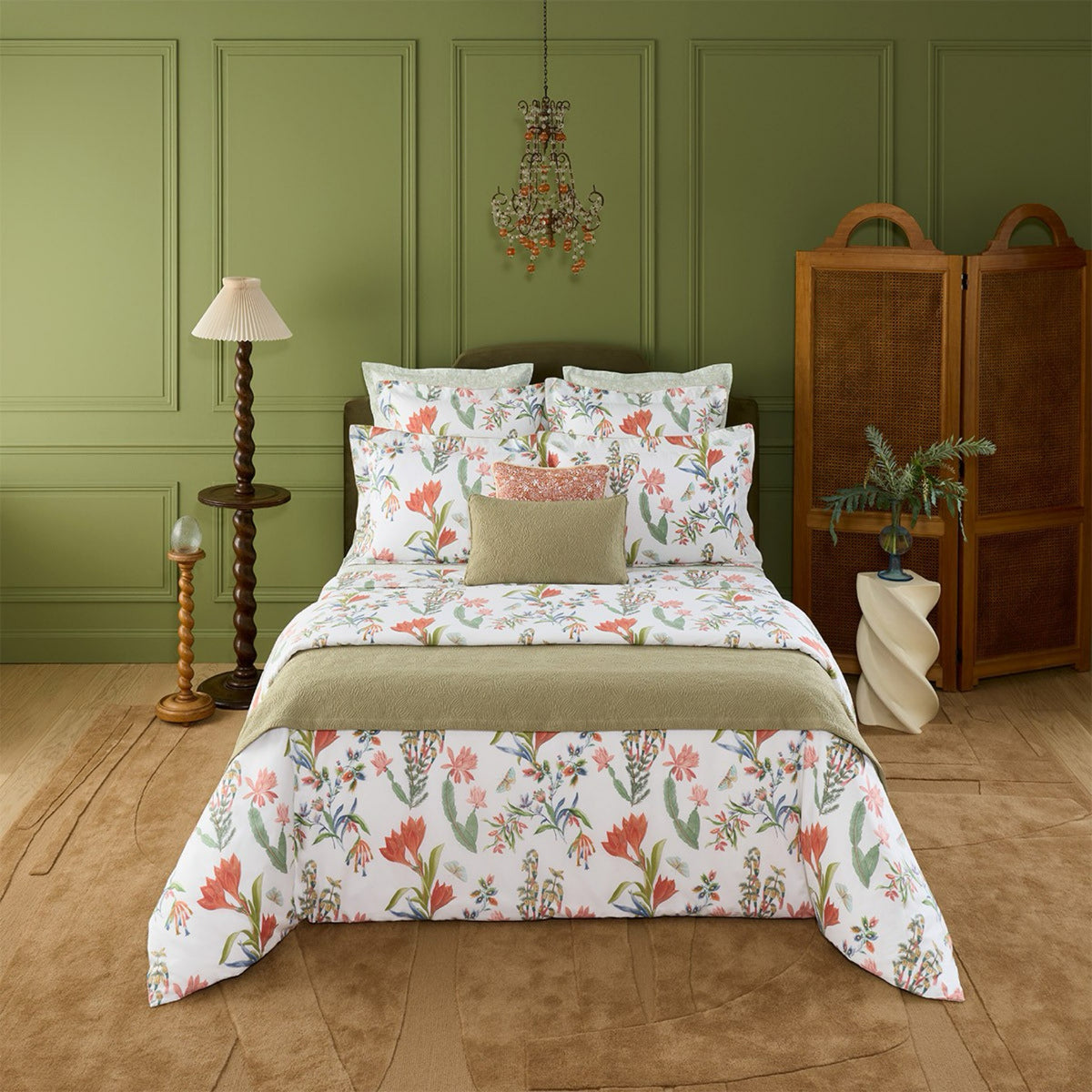 A neatly made bed with Yves Delorme Eze Bedding Collection