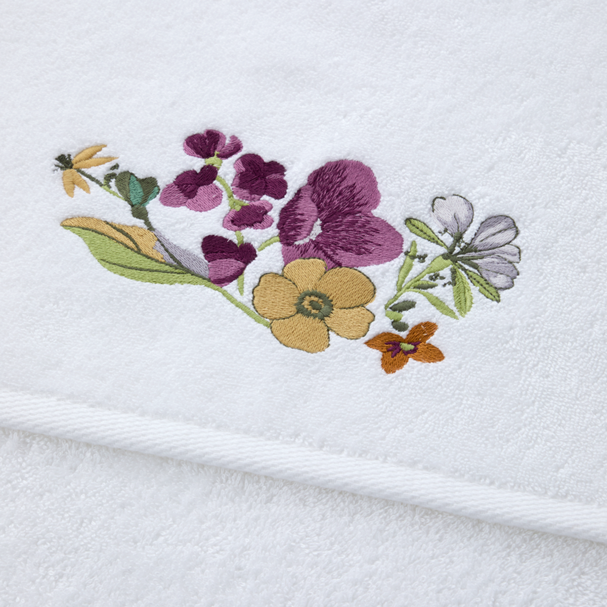 Closeup of Yves Delorme Fleurs Bath Trey blend organic fabric