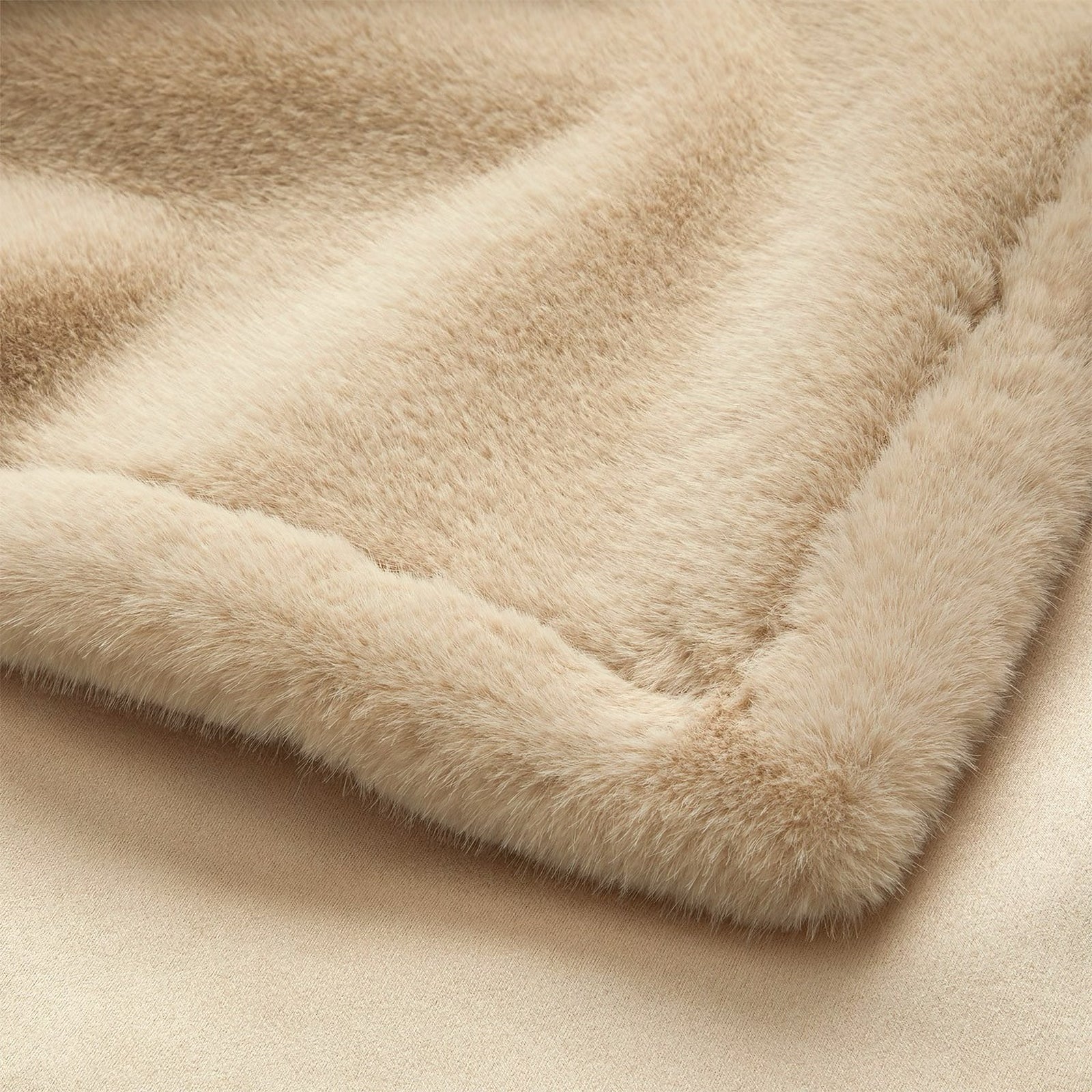 Folded Yves Delorme Frisson Throw in Noisette color