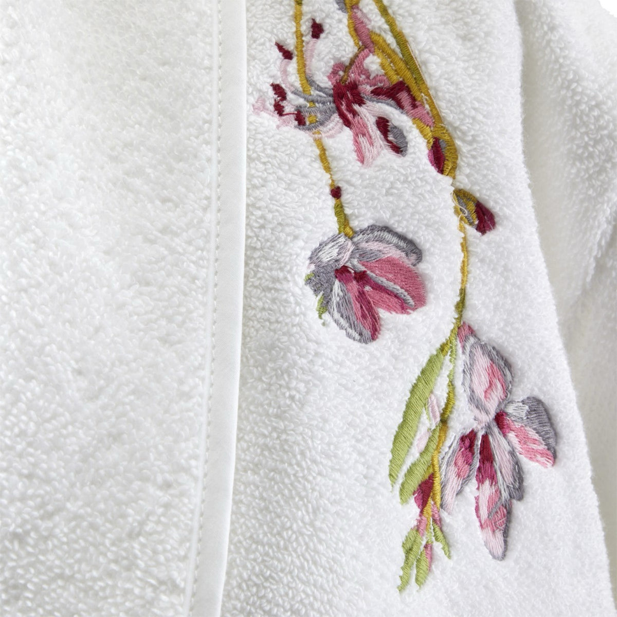 White textured fabric with floral embroidery from Yves Delorme Gaura Bath Robe