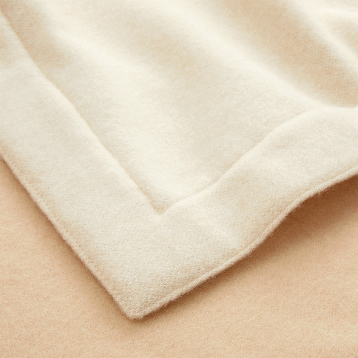 Yves Delorme Hestia Throw in Dune color made of merino wool