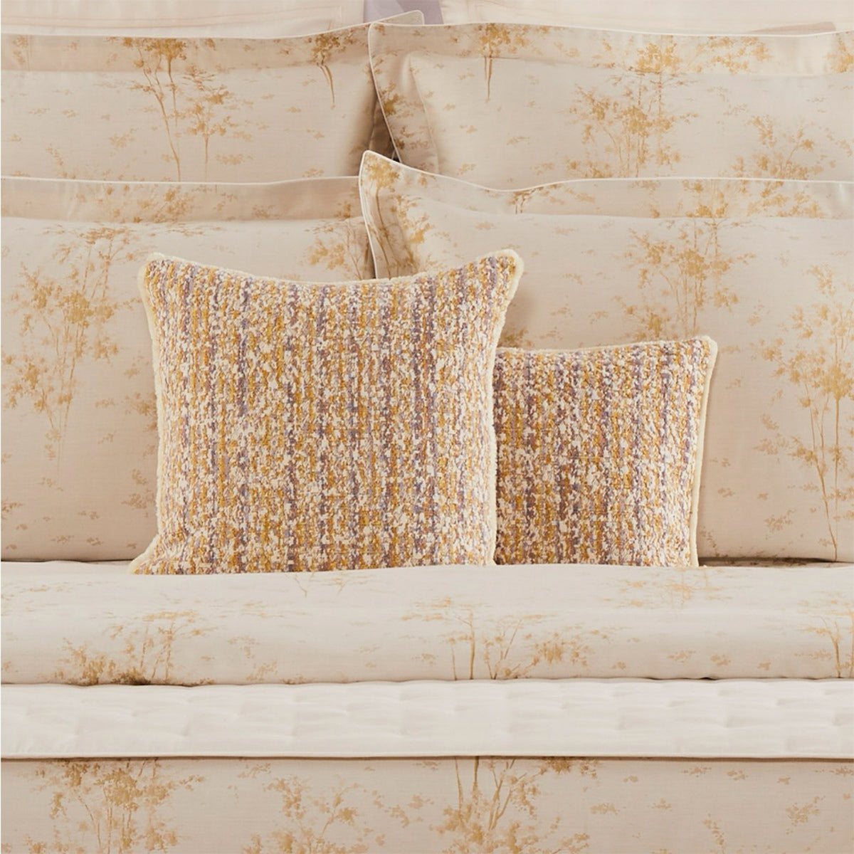 Yves Delorme Illusion Decorative Pillows in Orge color with beige coordinate bedding