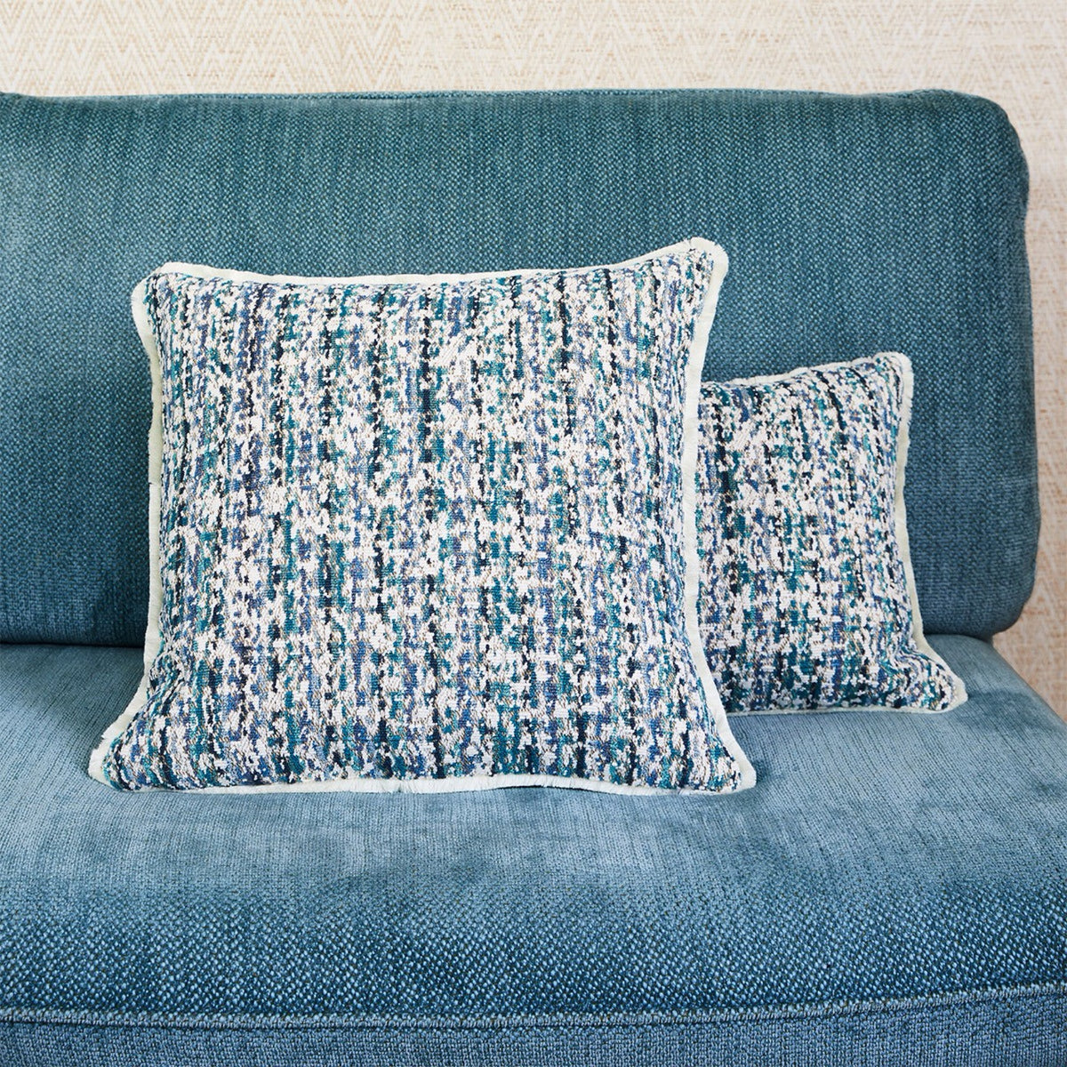 Yves Delorme Illusion Decorative Pillows in Paon color with beige coordinate bedding