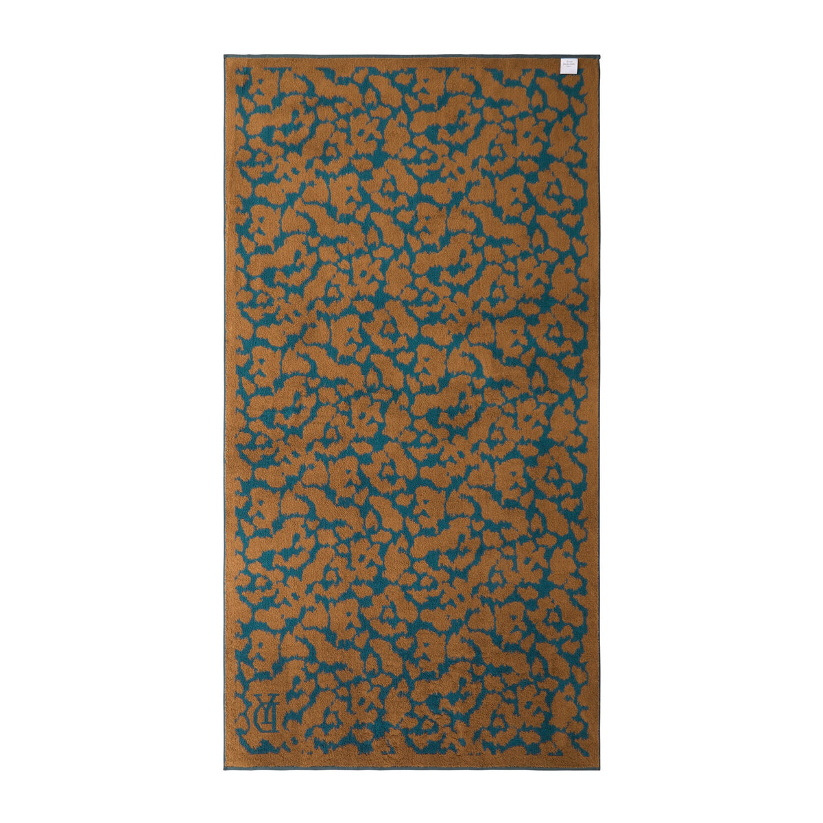 Back View of Yves Delorme Jaguar Beach Towel in Fauve Color