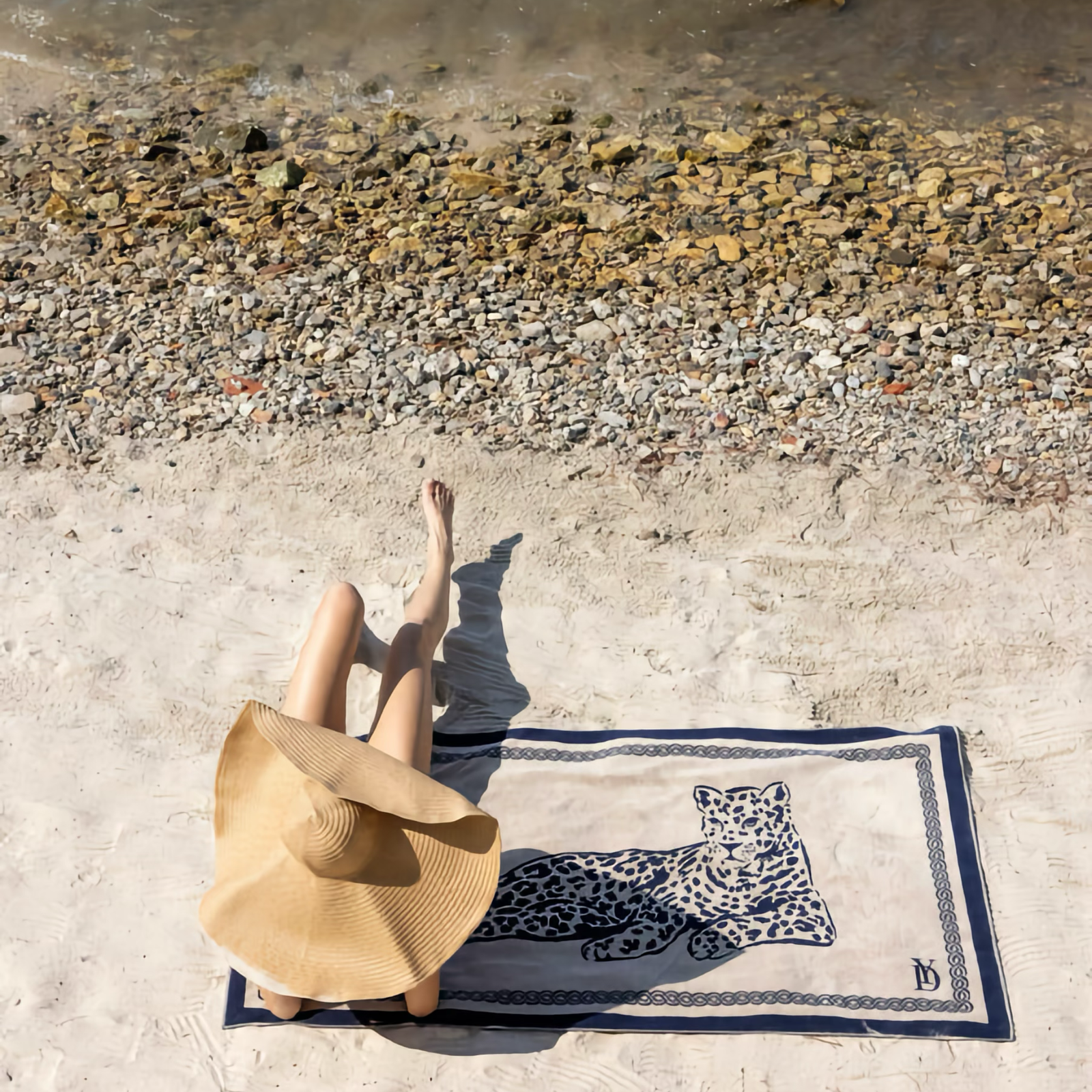 Woman on Yves Delorme Leopard Beach Towel