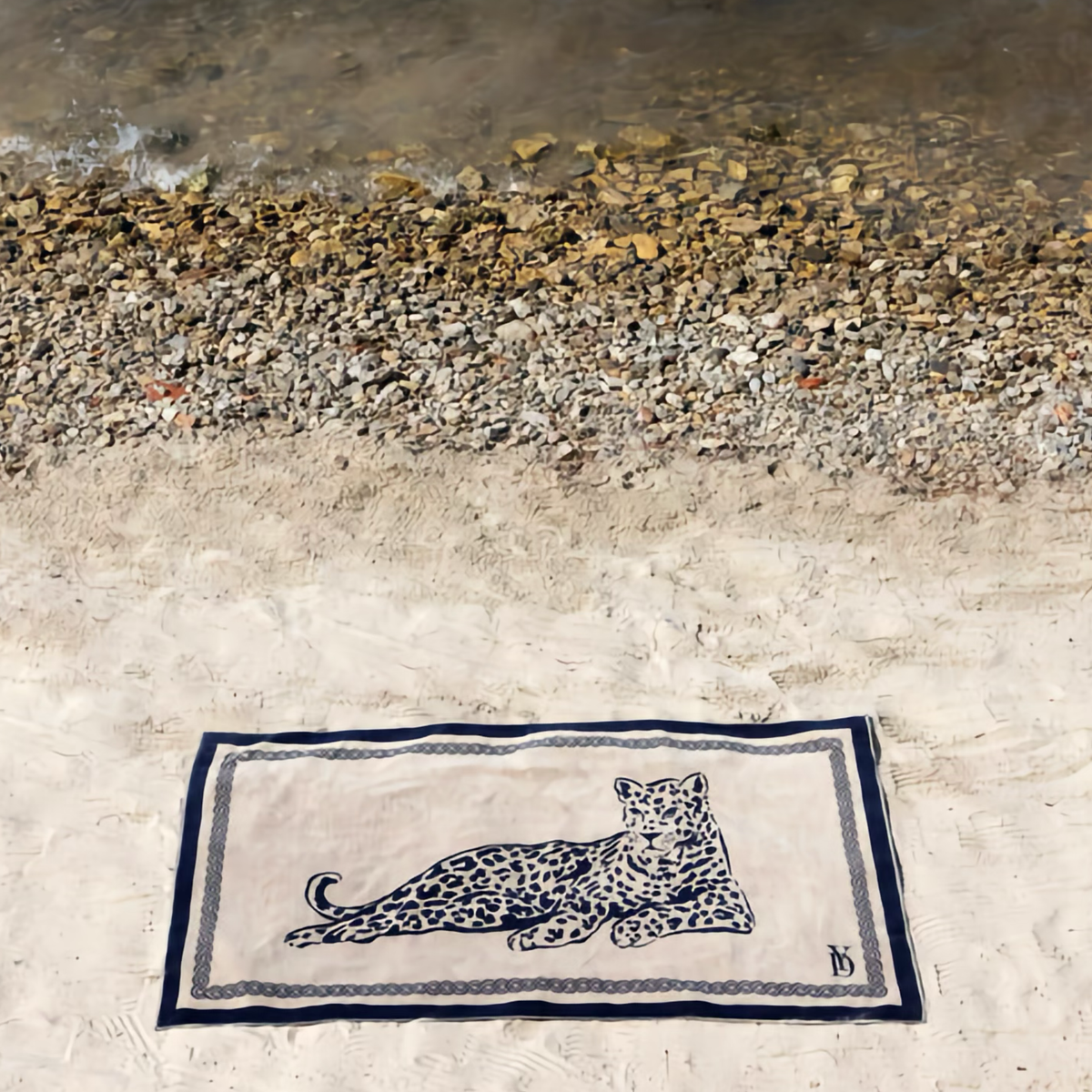 Yves Delorme Leopard Beach Towel on a beach