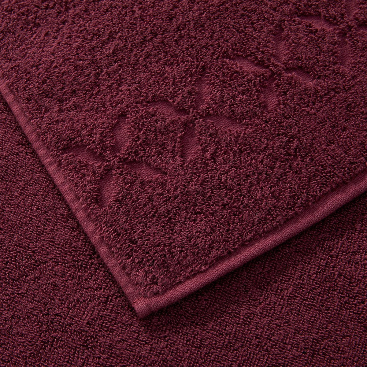 Close Up Image of Yves Delorme Nature Bath Towels and Mats in Prune Color