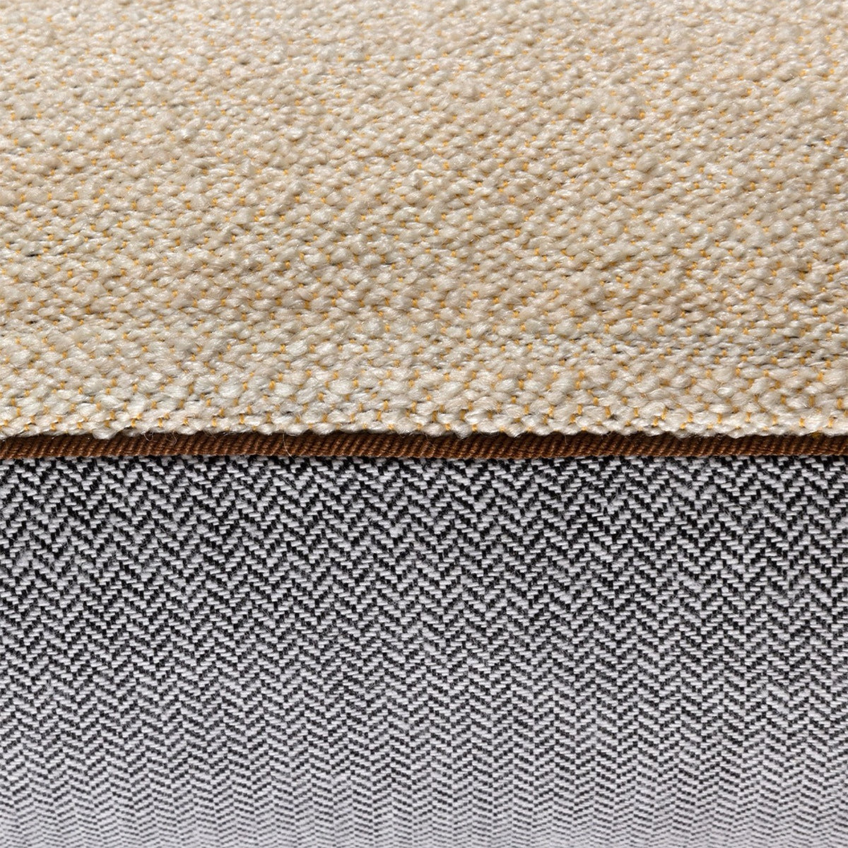 Closeup of Creme Yves Delorme Octavio Decorative Pillow with piped finish