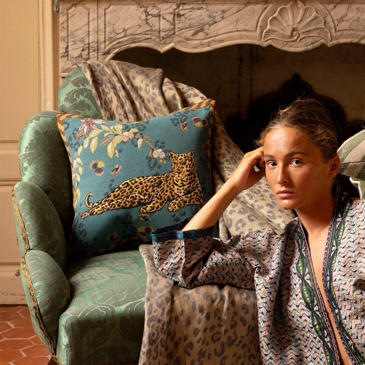 Model posing with Paon Yves Delorme Orchidia Decorative Pillow