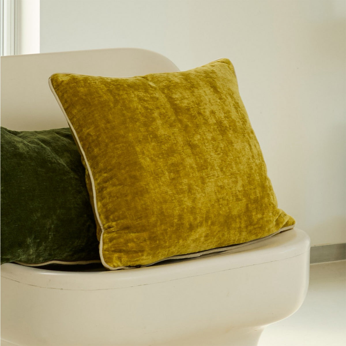 Pollen Yves Delorme Orpheo Decorative Pillow on a chair
