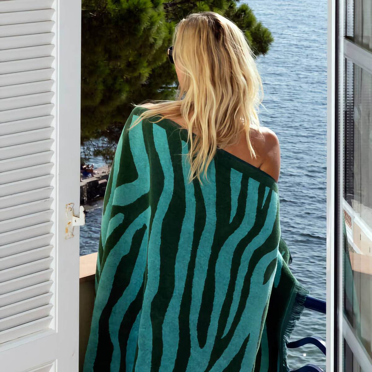 Model Wrapped in Yves Delorme Pampa Beach Towels in Menthe